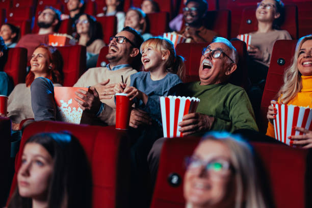 adults watching a movie at the theater 2