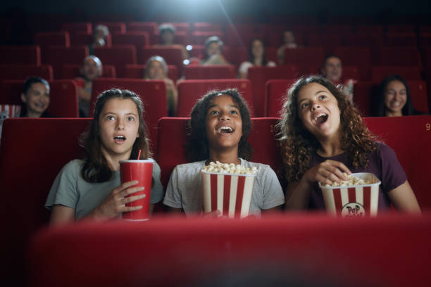 gradeschoolers watching a movie