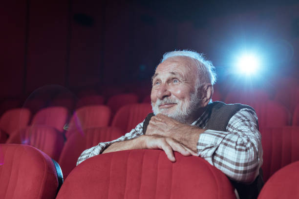 Senior man watching a movie at AMC
